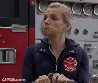 Woman Wearing Jacket That Says Fire Chicago Paramedic GIF
