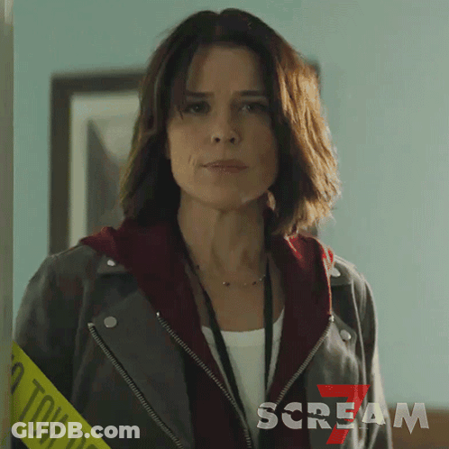 Woman Wearing Leather Jacket And Scream Lanyard GIF