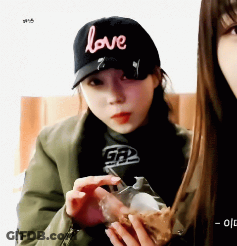 Woman Wearing Love Hat GIF