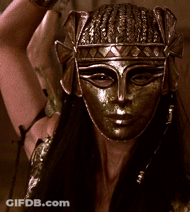 Woman Wearing Mask And Crown GIF