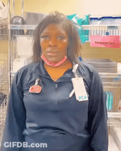 Woman Wearing Mask And PCA Name Tag GIF