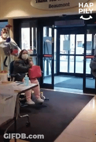 Woman Wearing Mask At Beaumont Sign GIF