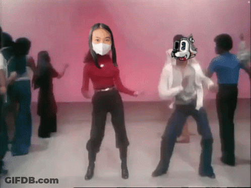 Woman Wearing Mask Dancing With Man Wearing Mask That Says 00 GIF