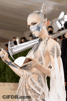 Woman Wearing Mask Holding Sword GIF