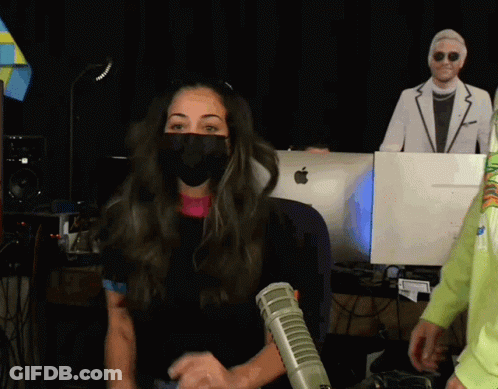 Woman Wearing Mask In Front Of Apple Monitor GIF