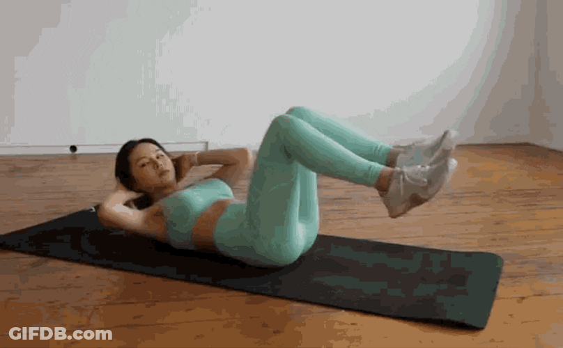 Woman Wearing Mint Green Doing Crunches GIF