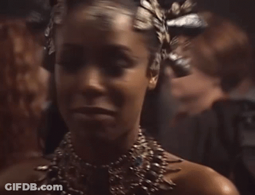 Woman Wearing Necklace And Crown GIF