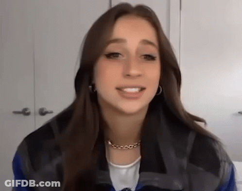 Woman Wearing Necklace And Earrings GIF