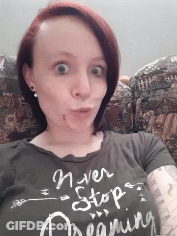 Woman Wearing Never Stop Dreaming Shirt GIF