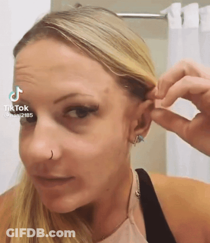 Woman Wearing Nose Ring And Earrings GIF