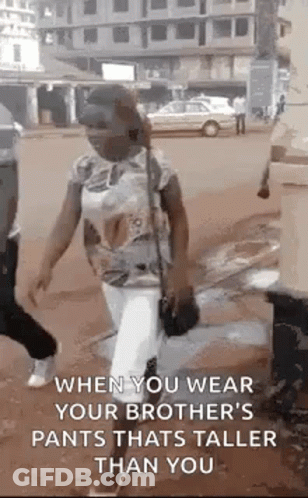 Woman Wearing Pants Taller Than Her GIF