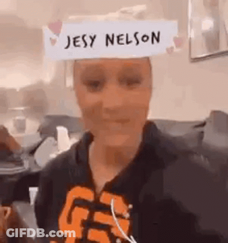 Woman Wearing Paper Hat Saying Jesy Nelson GIF