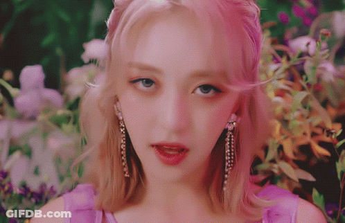 Woman Wearing Pink Earrings Close Up GIF