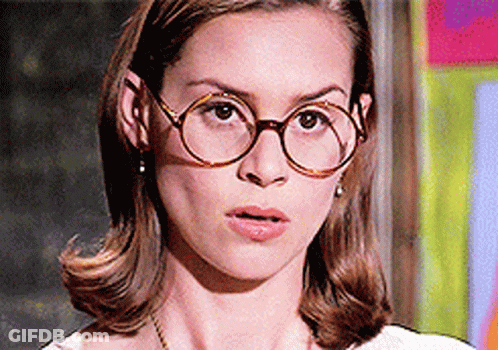 Woman Wearing Round Glasses And Earrings GIF