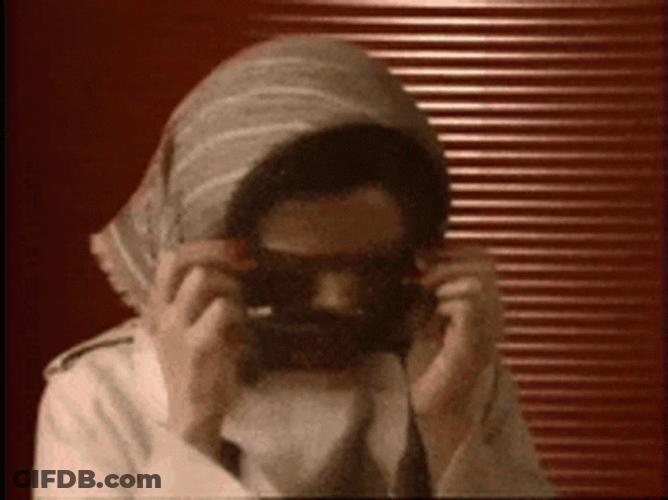 Woman Wearing Shades Hiding Meme GIF
