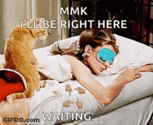 Woman Wearing Sleep Mask Lying In Bed With Cat GIF