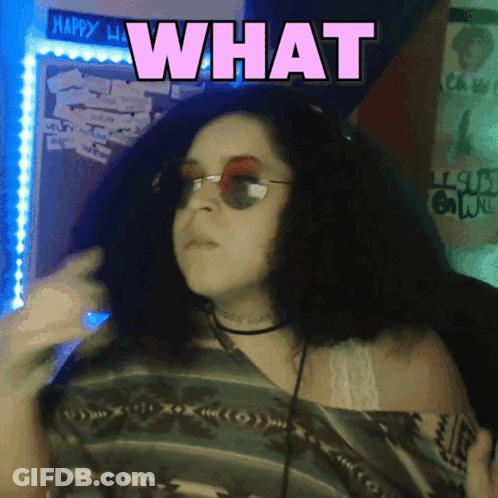 Woman Wearing Sunglasses And Choker Saying What GIF