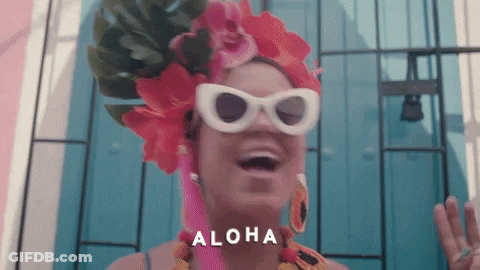Woman Wearing Sunglasses And Flowered Headpiece Says Aloha GIF