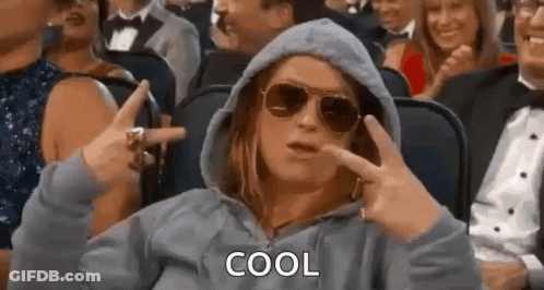 Woman Wearing Sunglasses And Hoodie Making Peace Sign GIF