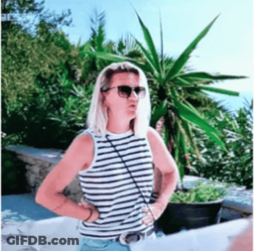 Woman Wearing Sunglasses And Striped Tank Top GIF