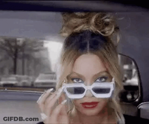 Woman Wearing Sunglasses Talking On Phone GIF