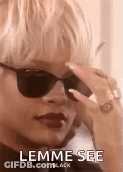 Woman Wearing Sunglasses Talking On Phone GIF