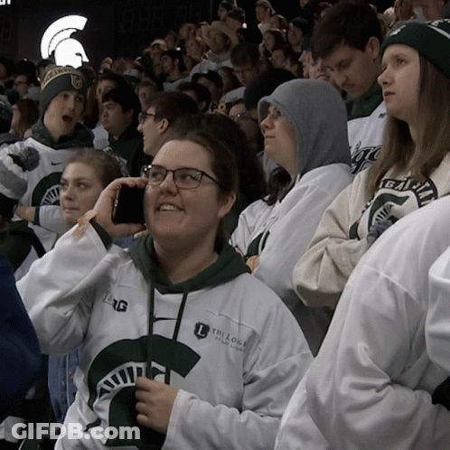 Woman Wearing The Lodge Of Michigan Sweatshirt GIF
