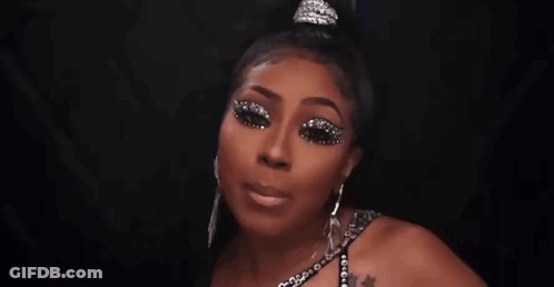 Woman Wearing Tiara And Gloves Making Funny Face GIF