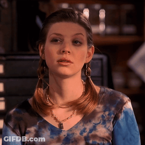 Woman Wearing Tie Dye Top And Necklace GIF