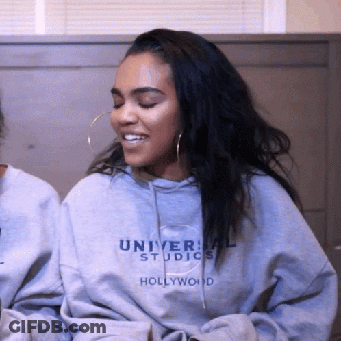 Woman Wearing Universal Studios Hoodie GIF