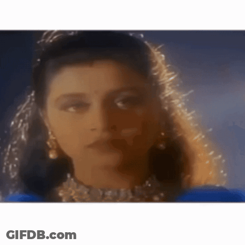 Woman Wearing Veil And Earrings GIF