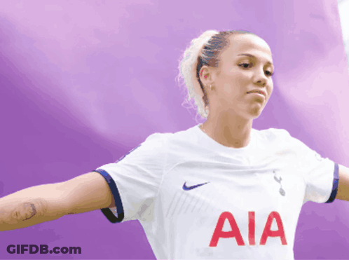 Woman Wearing White AIA Shirt GIF