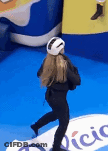 Woman Wearing White Helmet Standing On Blue Floor GIF