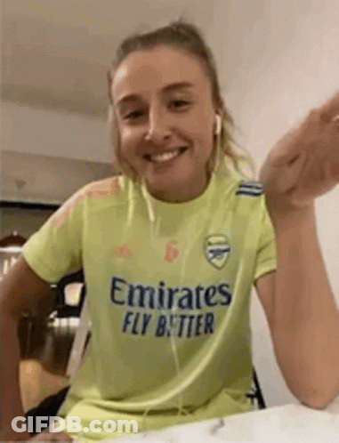 Woman Wearing Yellow Emirates Fly Better Shirt GIF