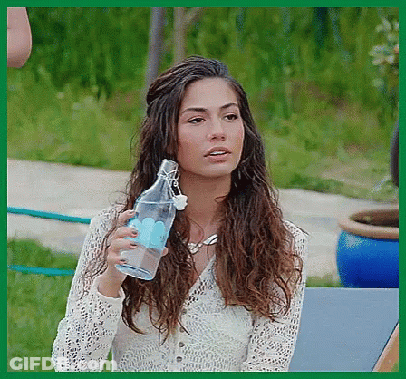 Woman White Lace Top Holding Clear Water Bottle GIF
