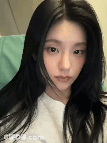 Woman White Shirt Long Black Hair Looking Camera GIF