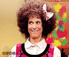 Woman With Afro And Bow Making Funny Face GIF