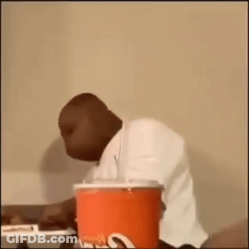 Woman With Afro In Tan Shirt GIF