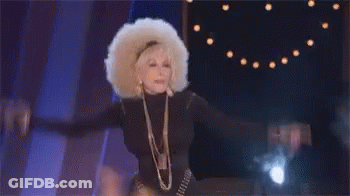 Woman With Afro Wig Dancing On Stage GIF
