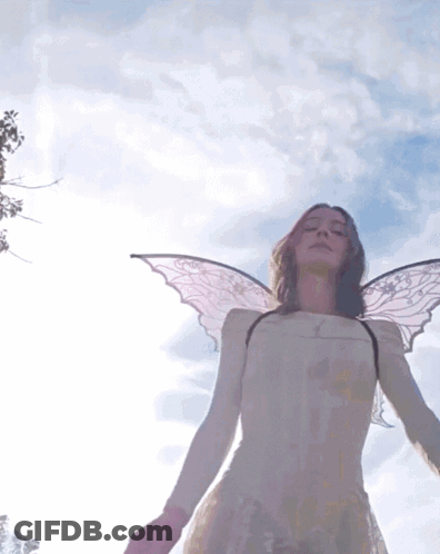 Woman With Angel Wings In White Dress Blue Sky GIF
