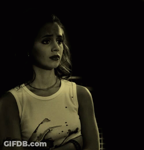Woman With Arm Tattoo In White Tank Top GIF