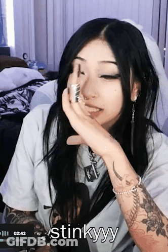 Woman With Arm Tattoo Saying Stinkyy GIF
