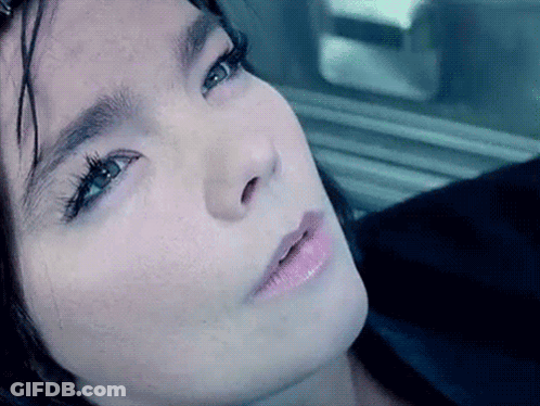 Woman With Arm Tattoo Smiling At Camera GIF