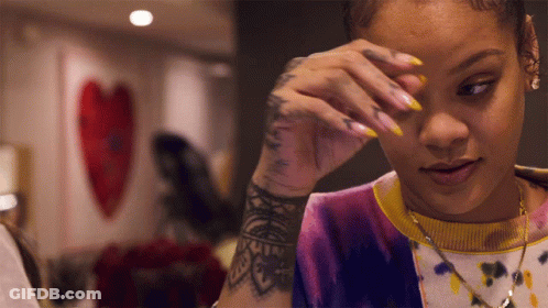 Woman With Arm Tattoo Wiping Eyes GIF