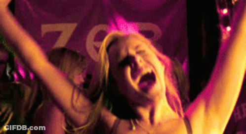 Woman With Arms Up In Front Of Z Sign GIF