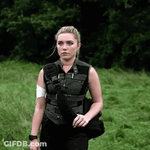 Woman With Bag And Bandaged Arm GIF