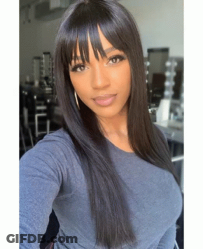 Woman With Bangs And Long Black Hair Taking Selfie GIF