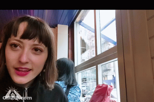 Woman With Bee Necklace GIF