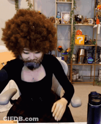 Woman With Big Afro And Beard At Microphone GIF