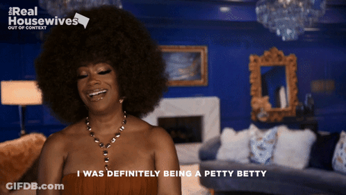 Woman With Big Afro Smiling I Was Definitely Being A Petty Betty GIF